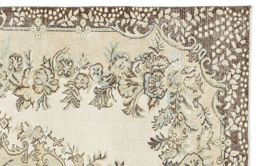 Load image 1 in gallery view. Cream, brown, and light blue traditional rug with a floral medallion pattern and a wide decorative border.