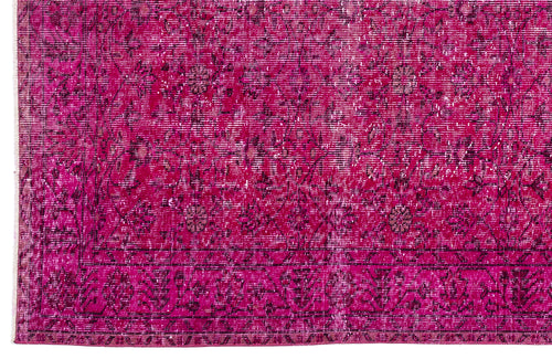 Load image 1 in gallery view. Magenta distressed rug with a dark floral medallion pattern and a geometric border.