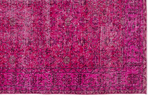 Load image 1 in gallery view. Magenta distressed rug with a traditional floral medallion pattern and a dark border.