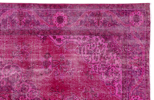 Load image 1 in gallery view. Magenta distressed rug with a traditional floral medallion pattern and a bordered edge.