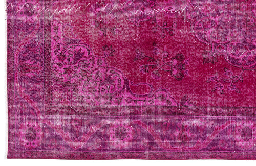 Load image 1 in gallery view. Magenta distressed rug with a traditional floral medallion pattern and a wide decorative border.