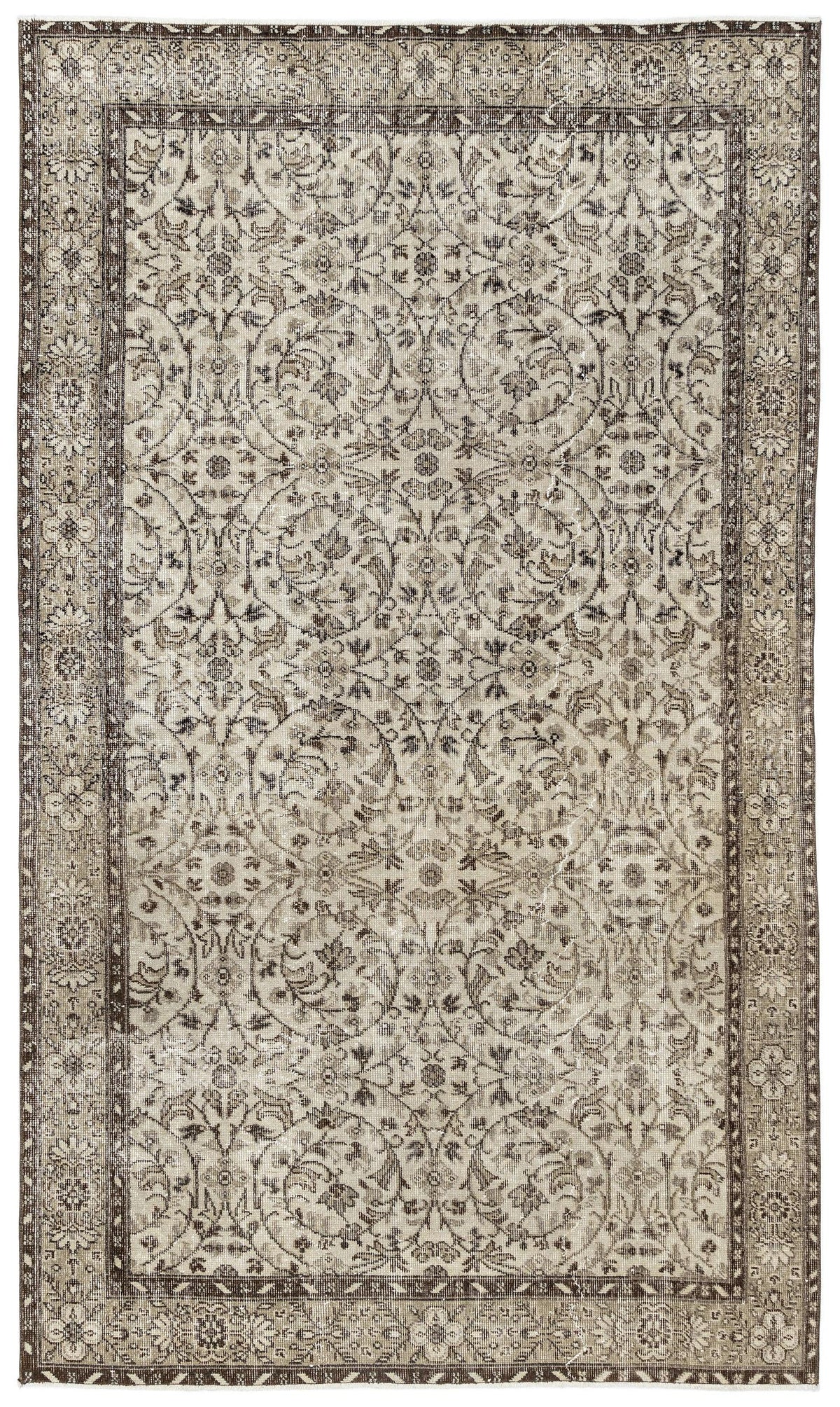 The Sigima Vintage Floral Rug (5'4 x 9'1) is a rectangular Anatolian hand-woven piece with an intricate, symmetrical beige, ivory, and brown floral and vine pattern, framed by a detailed decorative border.