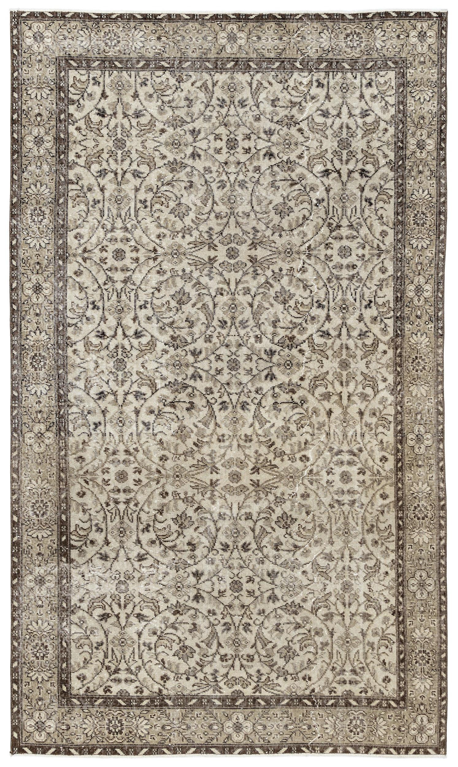 The Sigima Vintage Floral Rug (5'4 x 9'1) is a rectangular Anatolian hand-woven piece with an intricate, symmetrical beige, ivory, and brown floral and vine pattern, framed by a detailed decorative border.