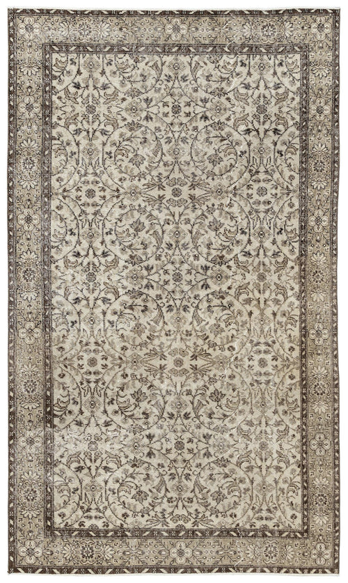 Load image 1 in gallery view. The Sigima Vintage Floral Rug (5'4 x 9'1) is a rectangular Anatolian hand-woven piece with an intricate, symmetrical beige, ivory, and brown floral and vine pattern, framed by a detailed decorative border.