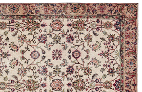 Load image 1 in gallery view. Beige traditional rug with a floral vine pattern in muted red, green, and navy blue, featuring a decorative border.