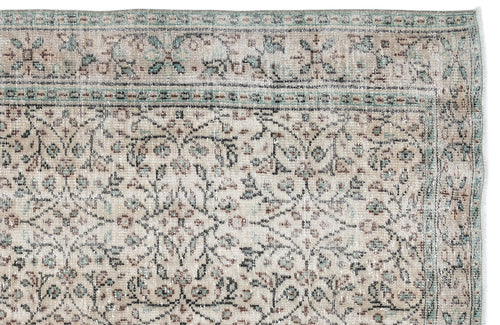 Load image 1 in gallery view. Beige and sage green traditional rug with a distressed floral pattern and a decorative border.