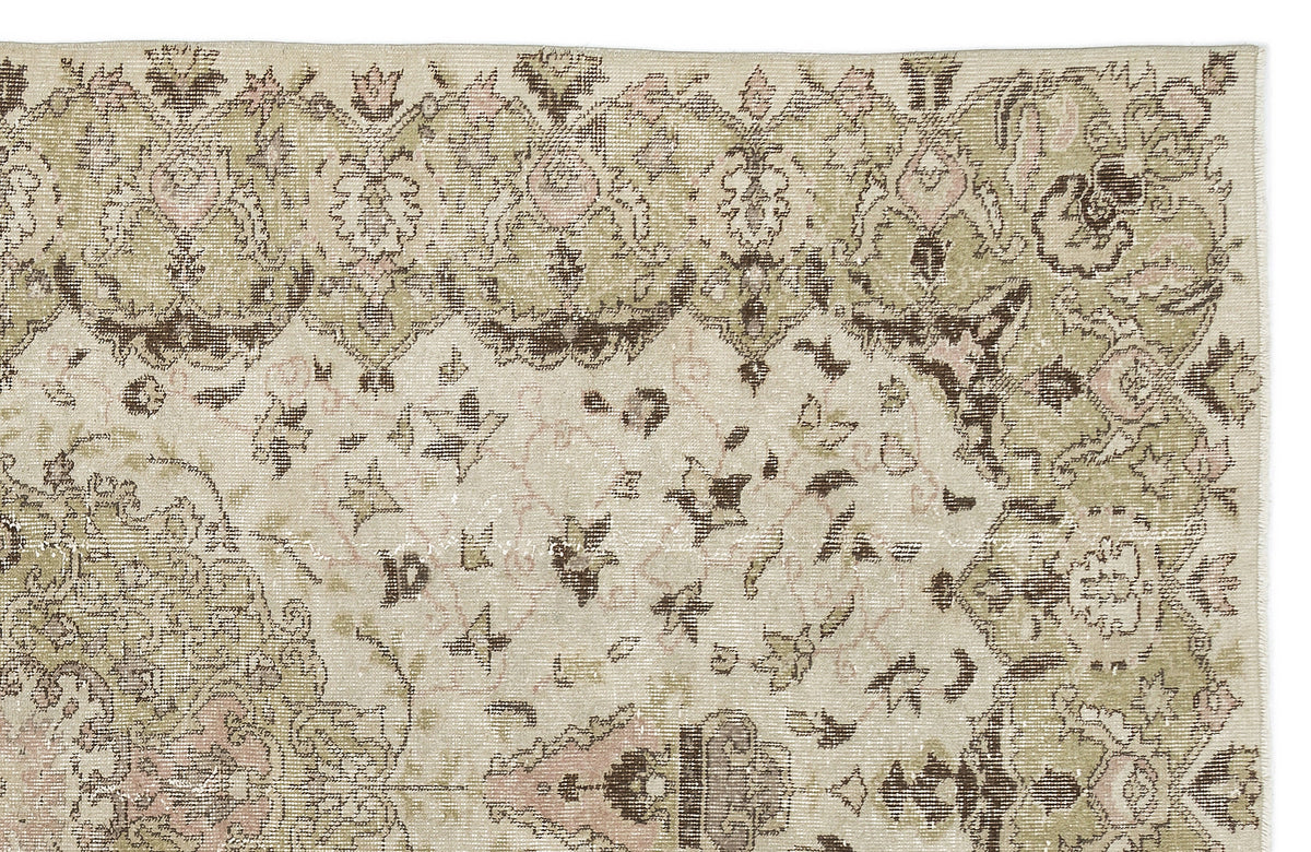 The Kaugila Vintage Medallion Rug (5'9" x 9'0") features a light beige center, faded green and brown floral motifs, and an ornate border in muted tones. Its flatwoven design offers a charming vintage look with slightly worn appeal.