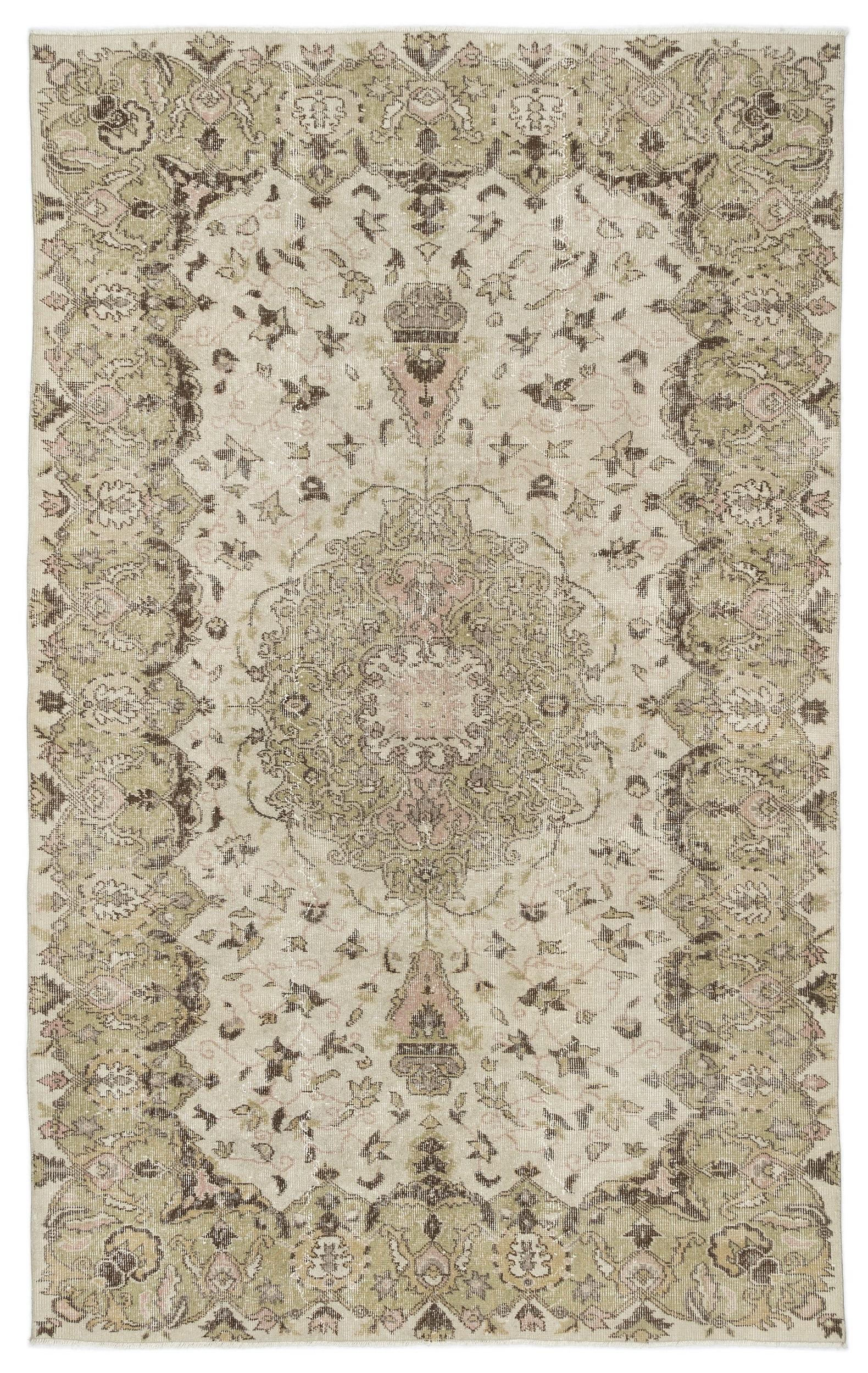 The Kaugila - Vintage Medallion Rug (5'9" x 9'0") features intricate floral and geometric patterns in muted beige, olive green, and light brown, highlighted by a large central medallion and decorative border.