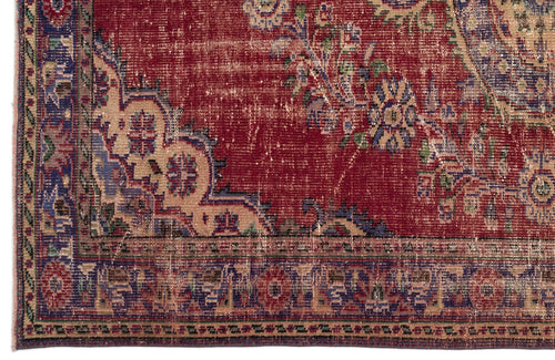 Load image 1 in gallery view. Distressed red traditional rug with blue and beige floral medallion patterns and a decorative border.
