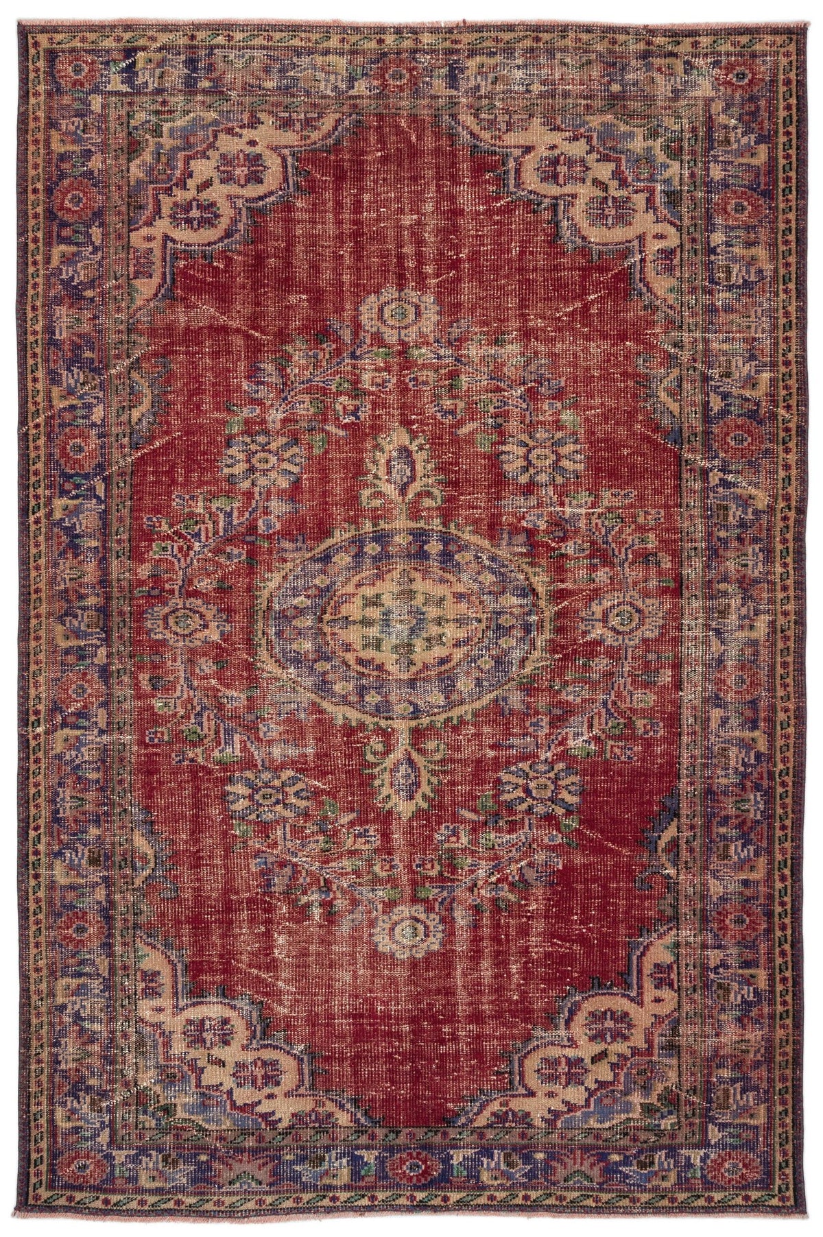 Distressed red traditional rug with a central blue and beige floral medallion and ornate border.