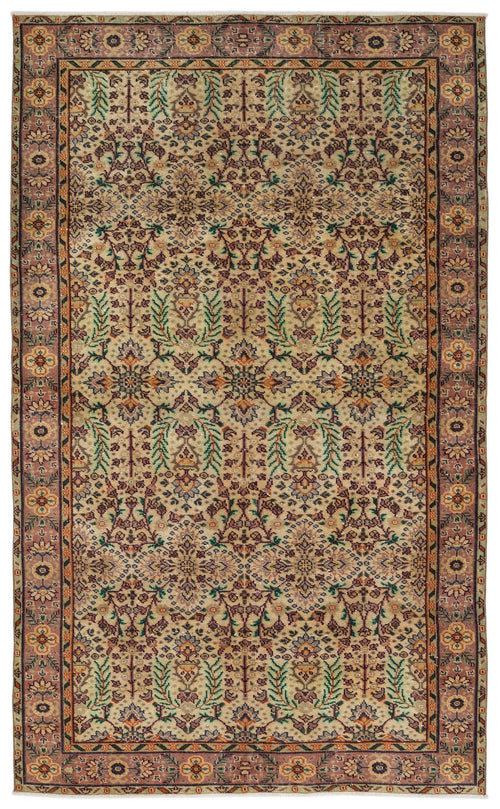 Load image 1 in gallery view. Beige traditional rug with a repeating floral medallion pattern in muted tones of green, rust, and purple.