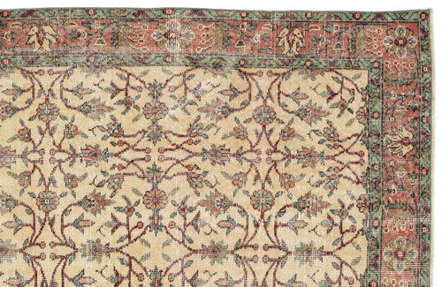 Load image 1 in gallery view. Beige traditional rug with a red and green floral vine border and a repeating botanical pattern in the center.