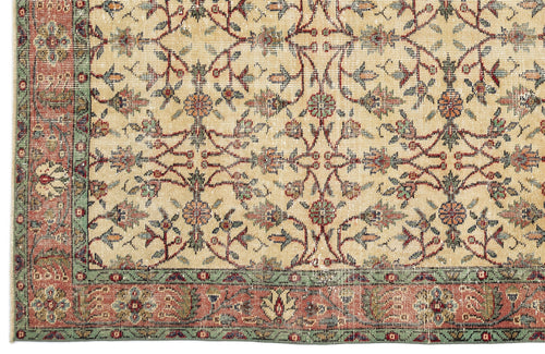 Load image 1 in gallery view. Beige rug with a traditional floral vine pattern in red, green, and blue, featuring a decorative multi-colored border.