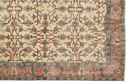 Load image 1 in gallery view. Beige rug with a traditional floral vine pattern in red, green, and blue, featuring a decorative border.