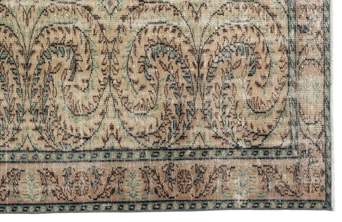Load image 1 in gallery view. Distressed beige and teal rug with a traditional paisley and floral medallion pattern and a geometric border.