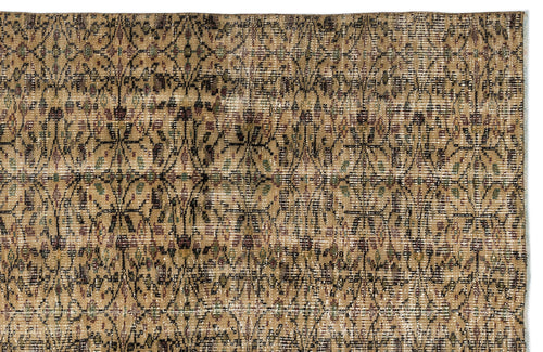 Load image 1 in gallery view. Tan and brown vintage-style rug with a distressed, repeating geometric lattice pattern and subtle green and maroon accents.