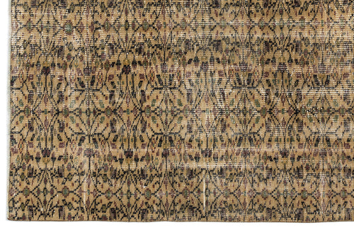 Load image 1 in gallery view. Tan and brown distressed rug with a repeating black geometric lattice pattern and small floral accents.