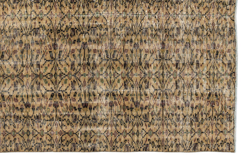 Load image 1 in gallery view. Tan and brown vintage-style rug with a distressed, repeating geometric lattice pattern and subtle multicolored accents.
