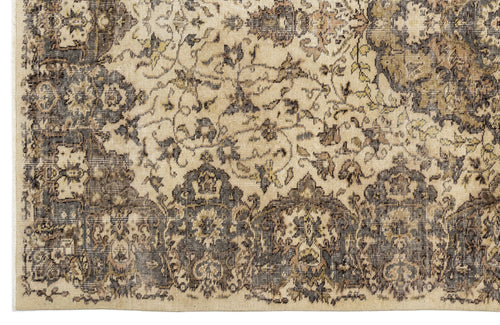 Load image 1 in gallery view. Beige and charcoal distressed rug with a traditional floral medallion pattern and a detailed border.