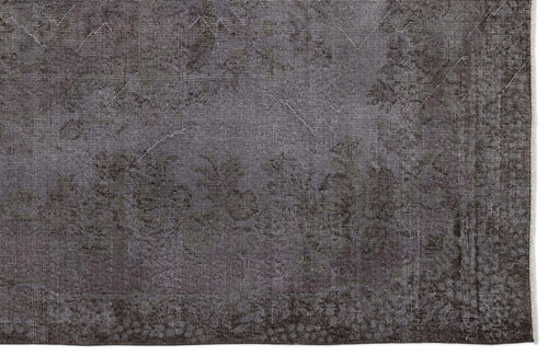 Load image 1 in gallery view. Charcoal grey rug with a faded, distressed traditional medallion pattern and a thin white fringe edge.