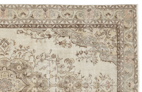 Load image 1 in gallery view. Beige and brown vintage-style rug with a distressed floral medallion pattern and ornate border.