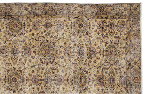 Load image 1 in gallery view. Distressed beige and brown rug with a traditional floral medallion pattern and a dark decorative border.