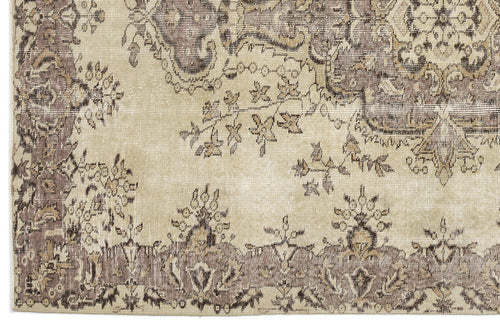 Load image 1 in gallery view. Beige and taupe rug with a distressed traditional floral medallion pattern and ornate border.