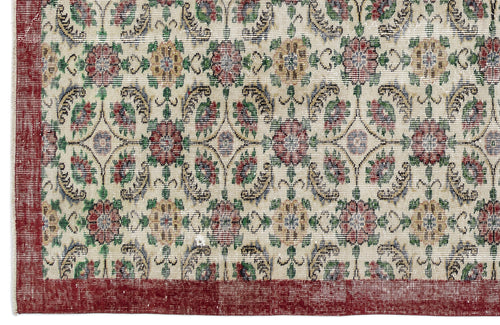Load image 1 in gallery view. Cream rug with a red border and a repeating floral medallion pattern in red, green, and gold.