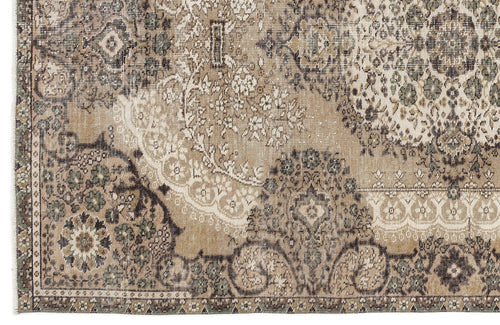 Load image 1 in gallery view. Distressed beige, brown, and sage green rug featuring a traditional floral medallion pattern with a faded finish.
