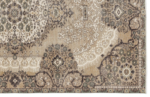 Load image 1 in gallery view. Beige, brown, and sage green rug with a distressed traditional floral medallion pattern.