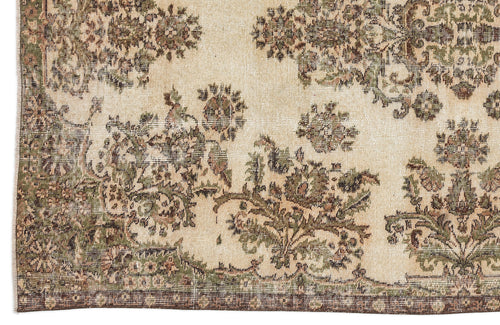 Load image 1 in gallery view. Distressed beige rug with olive green and brown floral medallion patterns and a dark border.