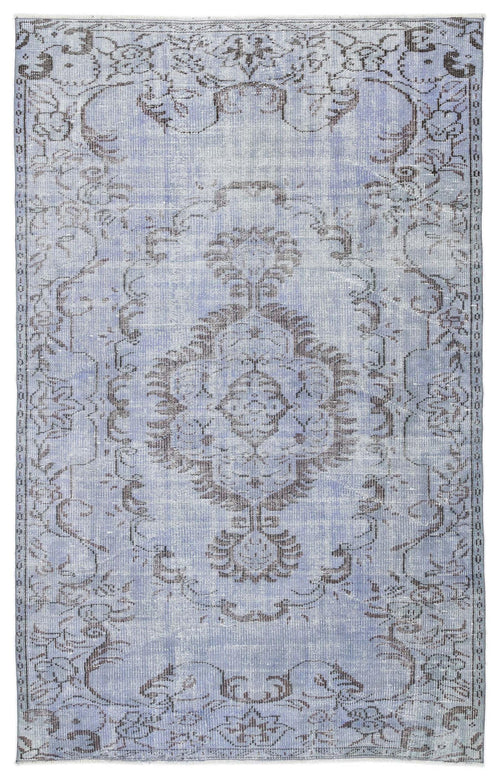 Load image 1 in gallery view. Periwinkle blue and charcoal grey vintage-style rug with a distressed central medallion and floral border.