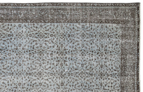 Load image 1 in gallery view. Charcoal and light blue distressed rug with a traditional floral medallion pattern and a wide decorative border.