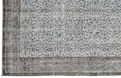 Load image 1 in gallery view. Distressed light blue and charcoal grey rug with a traditional ornate floral pattern and a wide solid border.
