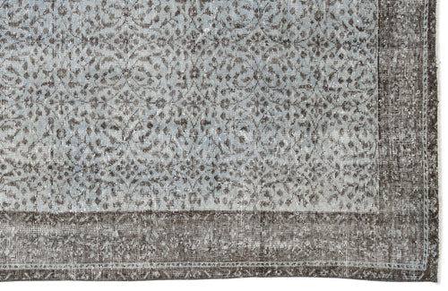 Load image 1 in gallery view. Light blue and charcoal grey rug with a distressed, intricate floral medallion pattern and a wide solid border.