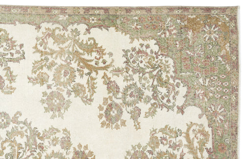 Load image 1 in gallery view. The Bofaya Vintage Medallion Rug (6'4" x 10'2") features a faded floral and vine pattern in muted green, beige, and pink on an ivory background, finished with an intricate patterned border.
