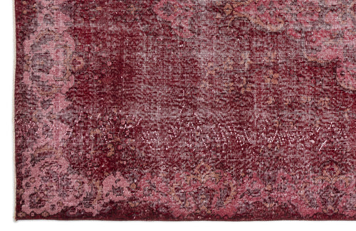Load image 1 in gallery view. Deep red and pink distressed traditional rug with a faded floral medallion pattern.