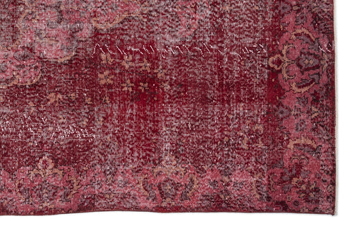 Load image 1 in gallery view. Deep red distressed rug with a faded floral medallion pattern and a decorative border.