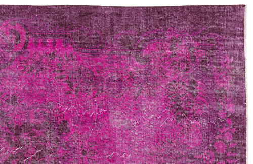 Load image 1 in gallery view. Magenta and deep purple distressed rug with a faded traditional floral pattern.