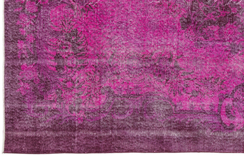 Load image 1 in gallery view. Magenta and deep purple distressed rug with a faded traditional floral medallion pattern.