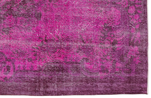 Load image 1 in gallery view. Magenta and deep purple distressed rug with a traditional floral medallion pattern.