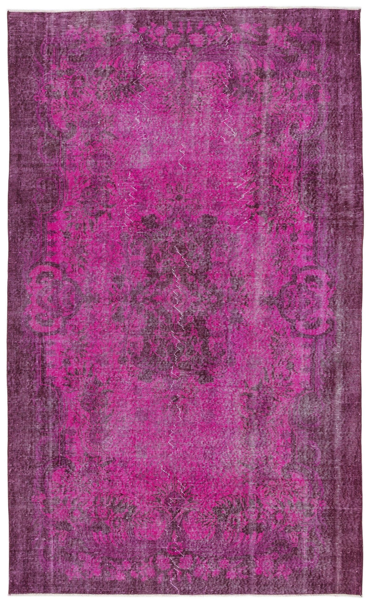 Magenta and deep purple distressed vintage-style rug with a faded traditional floral medallion pattern.