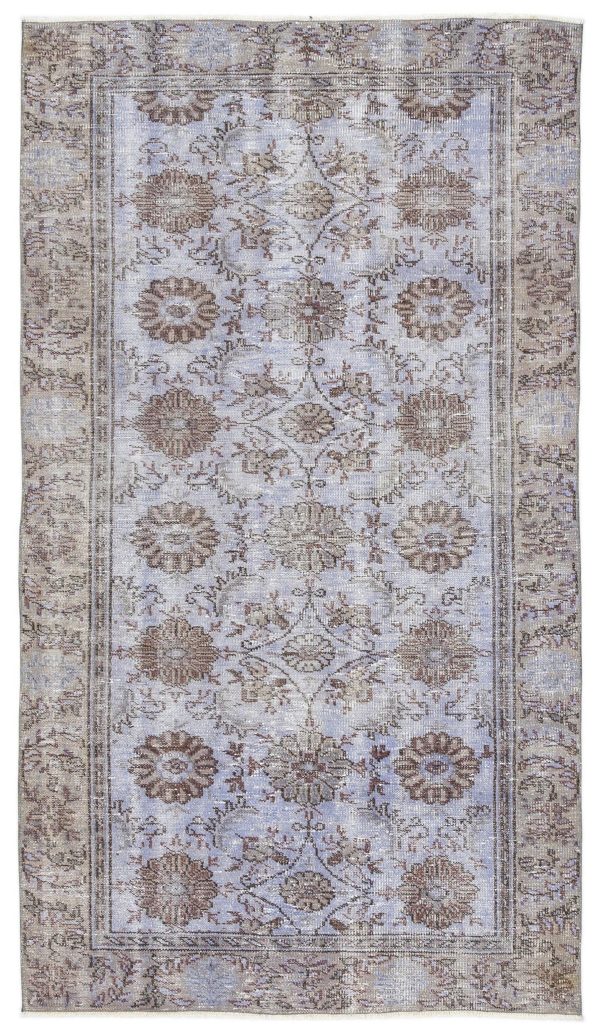 Light blue and taupe distressed rug with a traditional floral medallion pattern and a bordered edge.