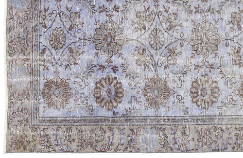 Load image 1 in gallery view. Periwinkle and taupe vintage-style rug with a distressed floral medallion pattern and a decorative border.