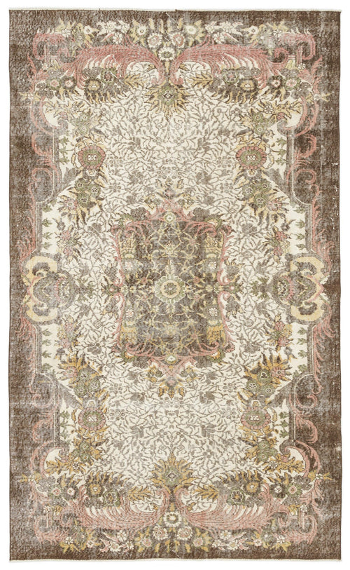 Load image 1 in gallery view. Brown, cream, and muted pink traditional rug with a central floral medallion and intricate botanical border.
