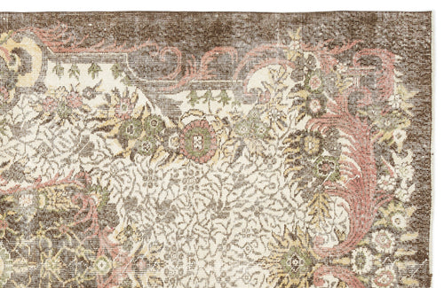 Load image 1 in gallery view. Distressed brown, cream, and muted pink rug with an intricate floral medallion pattern on a white background.
