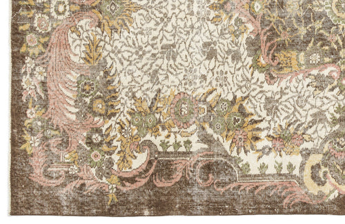 Load image 1 in gallery view. Brown, cream, and muted pink traditional floral medallion rug with a distressed, vintage-style finish.