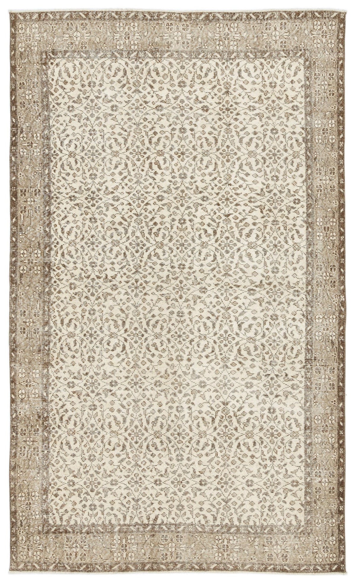 Beige and cream vintage-style rug with a distressed floral medallion pattern and a wide decorative border.