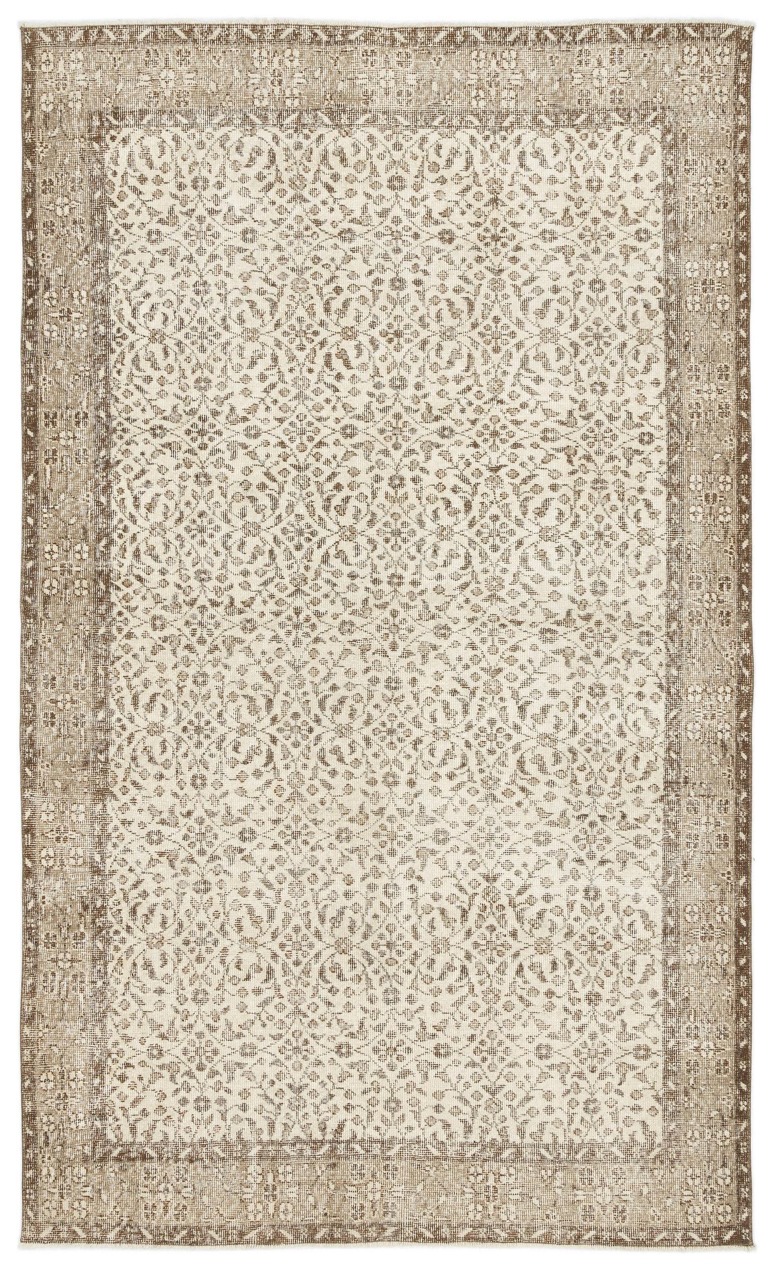 Beige and cream vintage-style rug with a distressed floral medallion pattern and a wide decorative border.