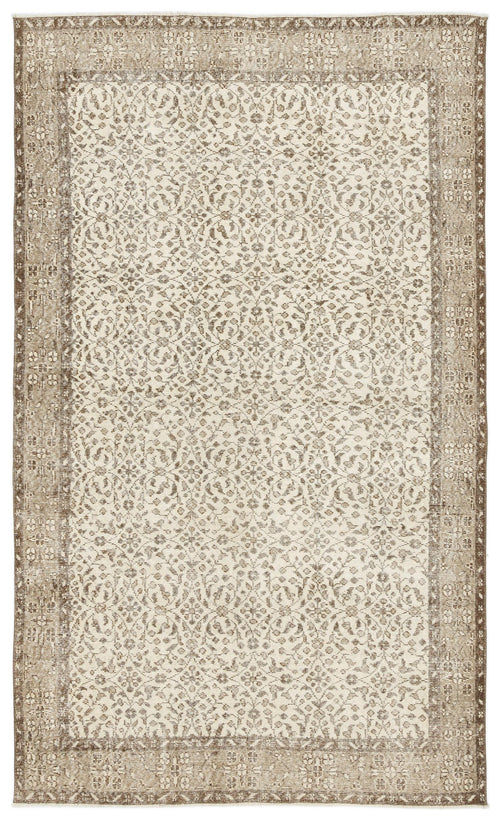 Load image 1 in gallery view. Beige and cream vintage-style rug with a distressed floral medallion pattern and a wide decorative border.